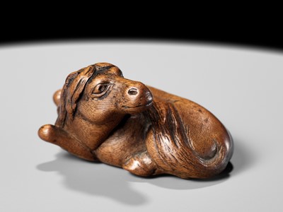 Lot 107 - YASUTADA: A RARE WOOD NETSUKE OF A RECUMBENT HORSE