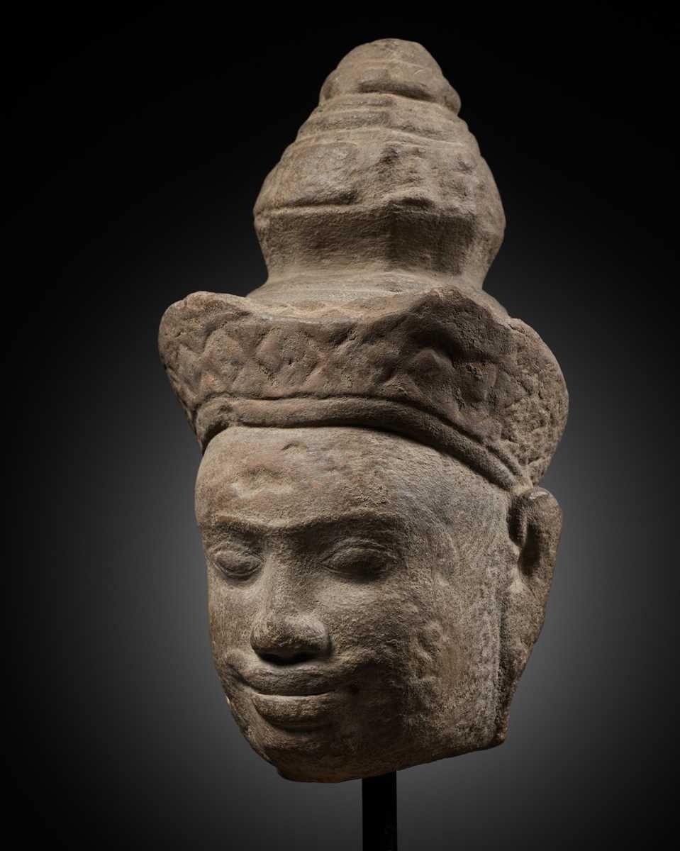 Lot 345 - A SANDSTONE HEAD OF VISHNU, ANGKOR PERIOD, 10TH-12TH CENTURY