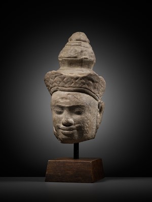 Lot 345 - A SANDSTONE HEAD OF VISHNU, ANGKOR PERIOD, 10TH-12TH CENTURY