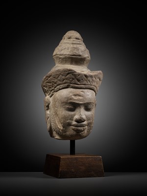 Lot 345 - A SANDSTONE HEAD OF VISHNU, ANGKOR PERIOD, 10TH-12TH CENTURY