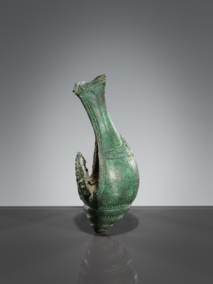 Lot 357 - A BRONZE RITUAL CONCH SHELL WITH A DANCING FIGURE OF HEVAJRA, ANGKOR PERIOD, BAYON STYLE