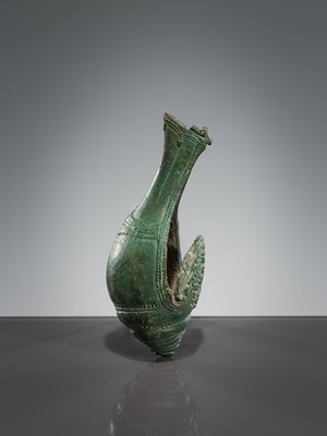 Lot 357 - A BRONZE RITUAL CONCH SHELL WITH A DANCING FIGURE OF HEVAJRA, ANGKOR PERIOD, BAYON STYLE