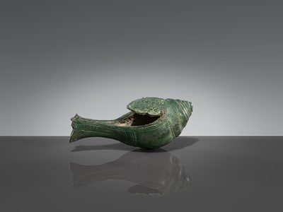 Lot 357 - A BRONZE RITUAL CONCH SHELL WITH A DANCING FIGURE OF HEVAJRA, ANGKOR PERIOD, BAYON STYLE