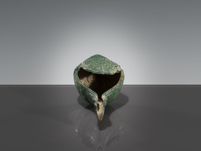 Lot 357 - A BRONZE RITUAL CONCH SHELL WITH A DANCING FIGURE OF HEVAJRA, ANGKOR PERIOD, BAYON STYLE