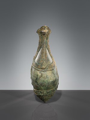 Lot 356 - A BRONZE RITUAL CONCH SHELL WITH A FIGURE OF HEVAJRA WITH YOGINIS, ANGKOR PERIOD, BAYON STYLE