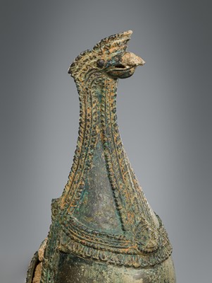 Lot 356 - A BRONZE RITUAL CONCH SHELL WITH A FIGURE OF HEVAJRA WITH YOGINIS, ANGKOR PERIOD, BAYON STYLE