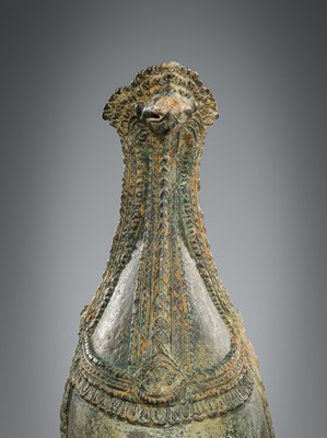 Lot 356 - A BRONZE RITUAL CONCH SHELL WITH A FIGURE OF HEVAJRA WITH YOGINIS, ANGKOR PERIOD, BAYON STYLE