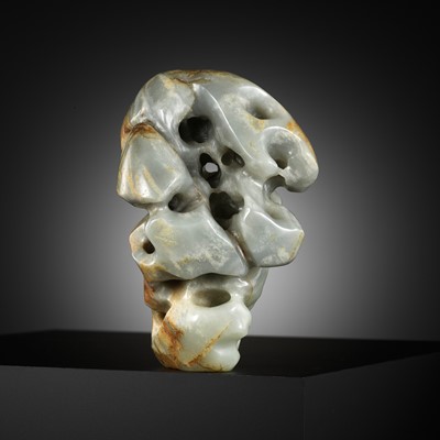 Lot 451 - A CELADON AND RUSSET JADE SCHOLAR’S ROCK, 17TH-18TH CENTURY