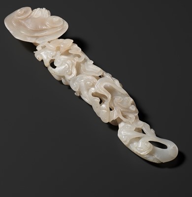 Lot 170 - A RETICULATED WHITE JADE RUYI IN THE FORM OF A LINGZHI WITH BATS, QING DYNASTY