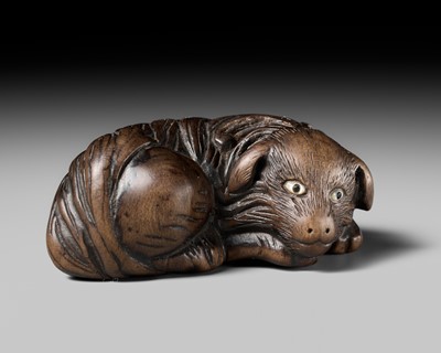 Lot 141 - A RARE WOOD NETSUKE OF A JAKONEKO (MUSK CAT)