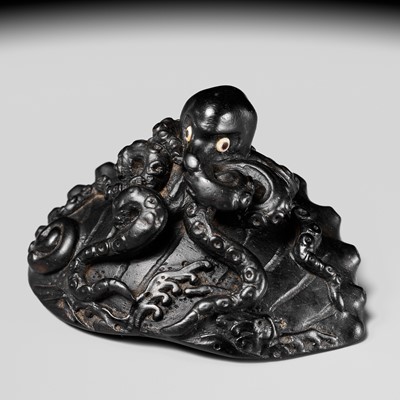 Lot 181 - YASUTSUGU: A LARGE EBONY WOOD NETSUKE OF AN OCTOPUS ON AN AWABI SHELL