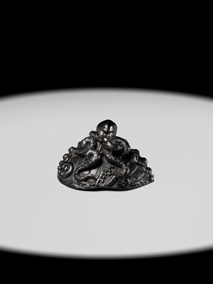 Lot 181 - YASUTSUGU: A LARGE EBONY WOOD NETSUKE OF AN OCTOPUS ON AN AWABI SHELL