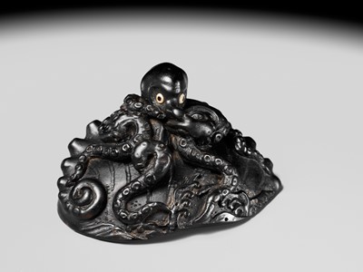 Lot 181 - YASUTSUGU: A LARGE EBONY WOOD NETSUKE OF AN OCTOPUS ON AN AWABI SHELL