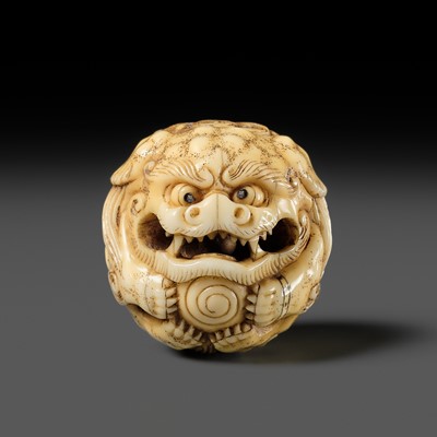 Lot 88 - A FINE IVORY NETSUKE OF A SHISHI BALL