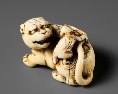 Lot 429 - A RARE IVORY NETSUKE OF A TIGER AND MONKEY