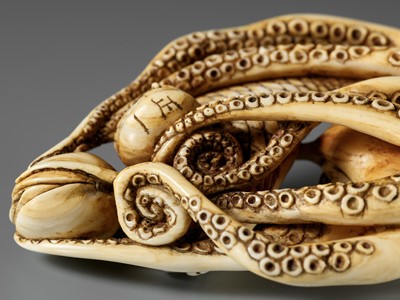 Lot 62 - MASAKAZU: A LARGE AND IMPRESSIVE OSAKA SCHOOL IVORY NETSUKE OF AN OCTOPUS WITH CLAMS