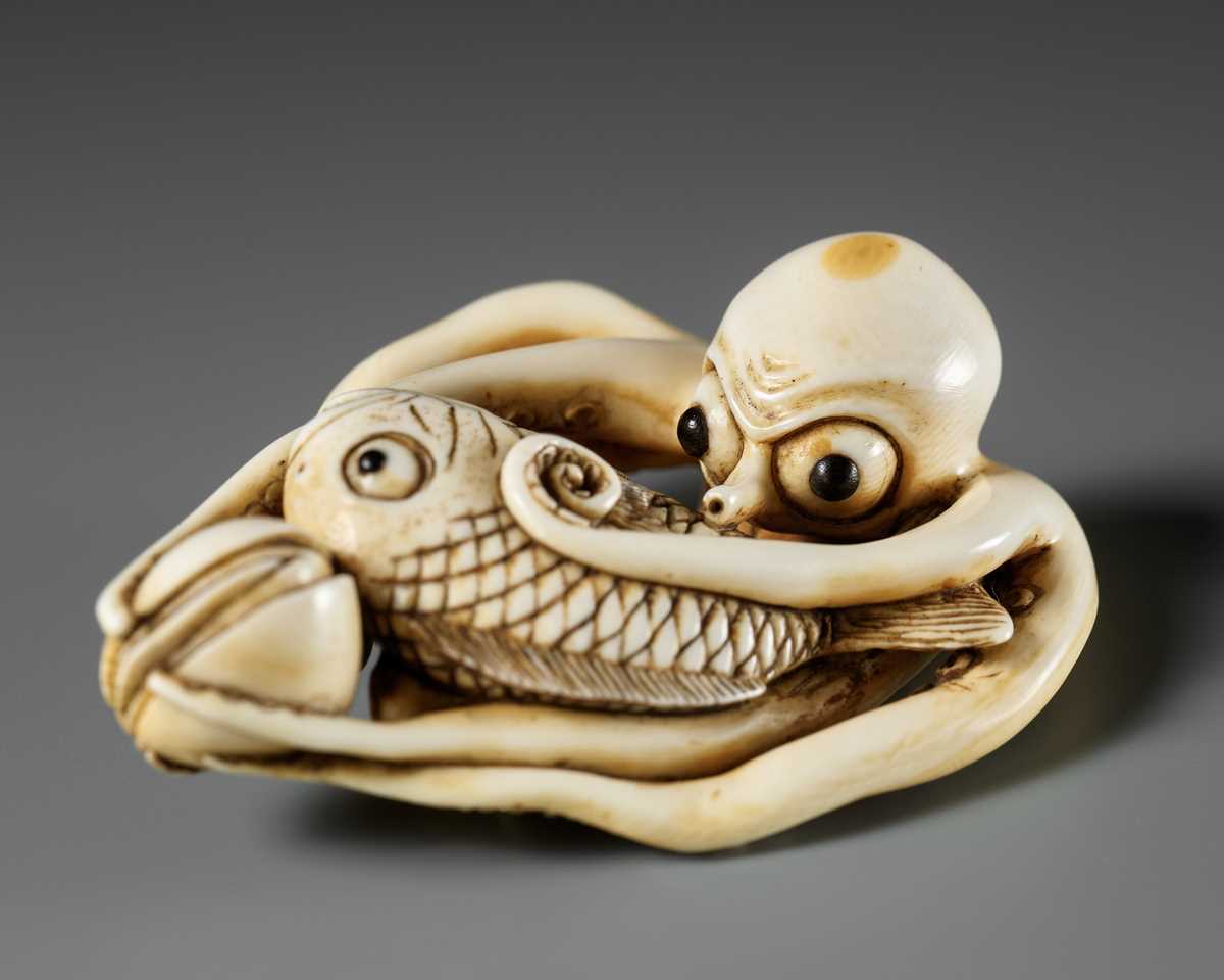 Lot 62 - MASAKAZU: A LARGE AND IMPRESSIVE OSAKA SCHOOL IVORY NETSUKE OF AN OCTOPUS WITH CLAMS