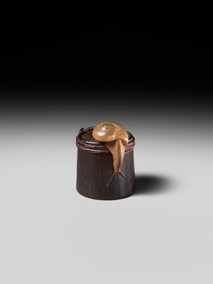 Lot 174 - SHIGEMASA: A SUPERB WOOD NETSUKE OF A SNAIL ON BUCKET