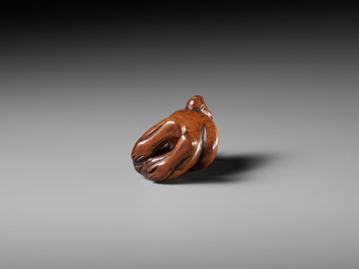 Lot 46 - AN EARLY WOOD NETSUKE OF A MONKEY WITH YOUNG