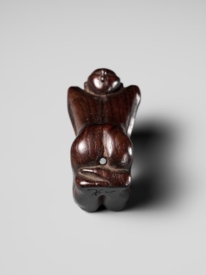 Lot 204 - KOICHI: AN UNUSUAL WOOD NETSUKE OF A KNEELING OLD MAN