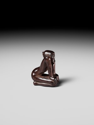 Lot 204 - KOICHI: AN UNUSUAL WOOD NETSUKE OF A KNEELING OLD MAN