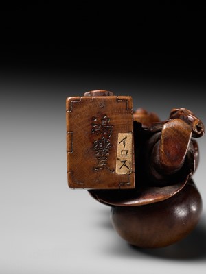 Lot 236 - HO RAKUMIN: A FINE WOOD NETSUKE OF DAIKOKU