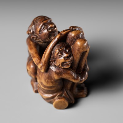 Lot 484 - A TOMOCHIKA SCHOOL WOOD NETSUKE OF ASHINAGA AND TENAGA