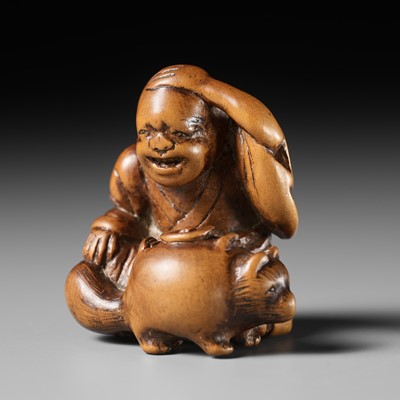 Lot 480 - AN EDO SCHOOL WOOD NETSUKE OF THE BUNBUKU-CHAGAMA