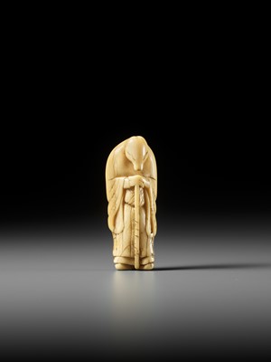 Lot 61 - A FINE IVORY NETSUKE OF A FOX PRIEST (HAKUZOSU)