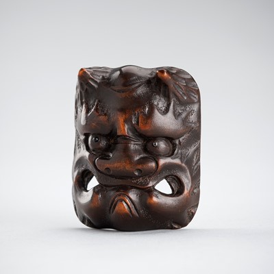 Lot 488 - MEIKEISAI HOJITSU: A RARE WOOD MASK NETSUKE OF AN ONI