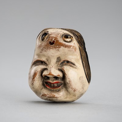 A LACQUERED WOOD NETSUKE OF OKAME, EDO PERIOD