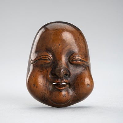 Lot 483 - A FINE WOOD MASK NETSUKE OF OKAME, EDO PERIOD