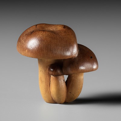 A FINE WOOD NETSUKE OF A MUSHROOM CLUSTER