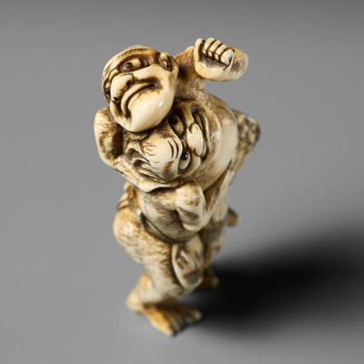 Lot 439 - A FINE OSAKA SCHOOL IVORY NETSUKE OF TWO SUMO WRESTLERS