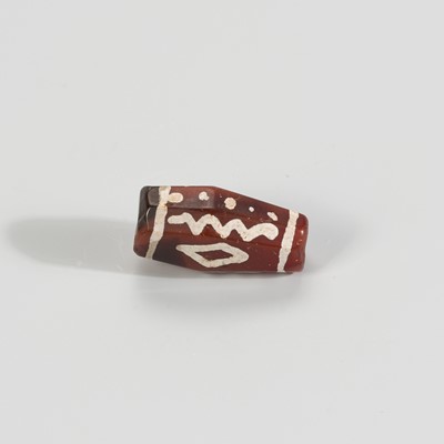 Lot 1146 - A DECORATED PYU CARNELIAN AGATE BEAD, ca. 7TH – 9TH CENTURY