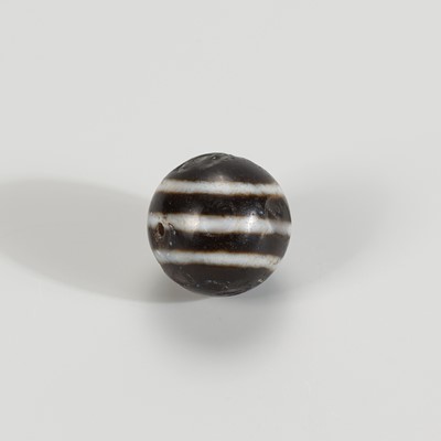 Lot 1143 - AN ANCIENT BURMESE GHOST EYE AGATE BEAD, 7th – 9th CENTURY