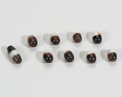 Lot 1540 - A LOT WITH NINE HIMALAYAN AGATE BEADS, 19TH CENTURY OR EARLIER