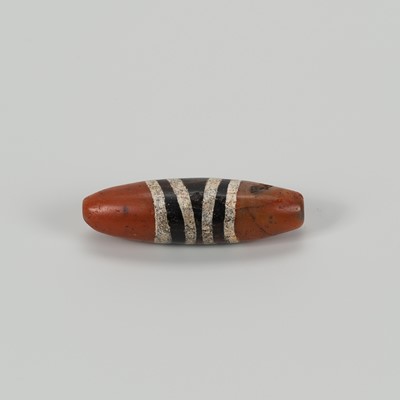 Lot 1507 - AN ETCHED TIBETAN AGATE ‘CHUNG DZI’ BEAD, c. 500-1000 CE