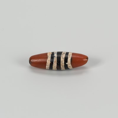 Lot 1513 - AN ETCHED TIBETAN AGATE ‘CHUNG DZI’ BEAD, c. 500-1000 CE