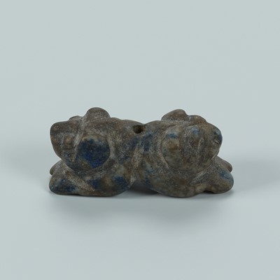 Lot 1387 - A BACTRIAN LAPIS LAZULI AMULET OF A DOUBLE-TIGER, c. 2500 YEARS OLD