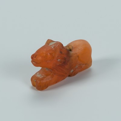 Lot 1362 - A BACTRIAN CARNELIAN AMULET OF A LION, c. 2500 YEARS OLD