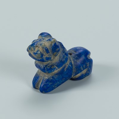 Lot 1378 - A BACTRIAN LAPIS LAZULI AMULET OF A LION, c. 2500 YEARS OLD