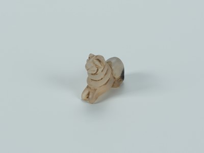 Lot 1393 - A BACTRIAN AGATE AMULET OF A LION, c. 2500 YEARS OLD