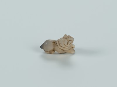 Lot 1393 - A BACTRIAN AGATE AMULET OF A LION, c. 2500 YEARS OLD