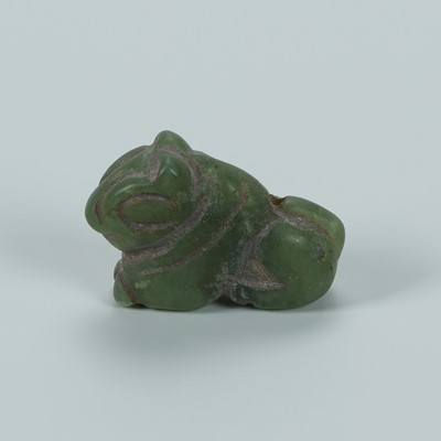 Lot 1398 - A BACTRIAN SERPENTINE ‘LION’ AMULET, c. 2500 YEARS OLD