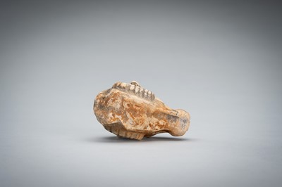 Lot 1422 - A SMALL BACTRIAN STONE CARVING OF A GOAT HEAD