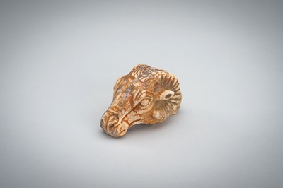 Lot 1422 - A SMALL BACTRIAN STONE CARVING OF A GOAT HEAD