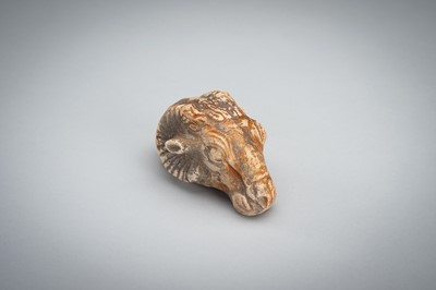 Lot 1422 - A SMALL BACTRIAN STONE CARVING OF A GOAT HEAD