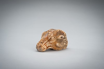 Lot 1422 - A SMALL BACTRIAN STONE CARVING OF A GOAT HEAD