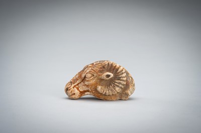 Lot 1422 - A SMALL BACTRIAN STONE CARVING OF A GOAT HEAD